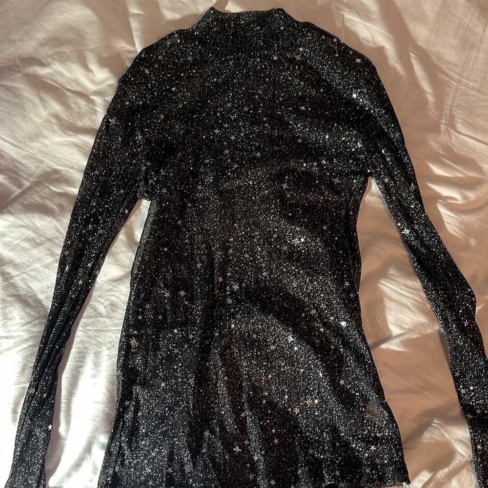 Black sparkly starry long sleeve. Size medium.